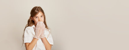 Shy little lady. Banner of little charming girl wearing white gloves and closed mouth over light background. Concept of carefree childhood, holidays, fun, human emotionの写真素材