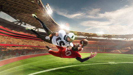 Competition on green grass. Professional american football players in motion and action with ball during match over 3 D model of grand arena. Concept of art, sport, team, energy and power, adの写真素材