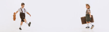 Collage with little cute boys wearing old-fashioned vintage clothes holding suitcase and walking over white background. Banner. Concept of kids fashion, retro style, childhood, vintage, weekend, adの写真素材