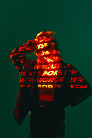 Wrong decision. Portrait of pretty girl wearing sunglasses and digital neon filter lights with inscryption on body on dark green mode background. Concept of digital art, fashion, cyberpunk, futurismの写真素材