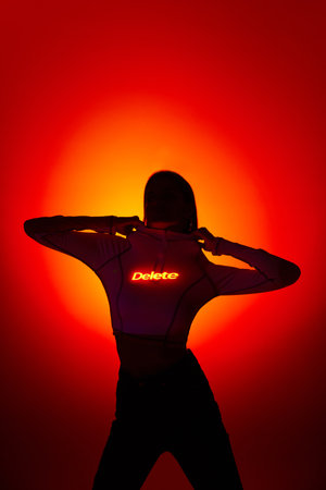 A break up, delete. Portrait with sensual female silhouette and digital neon filter lights with...