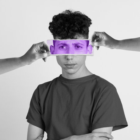 Feeling dad and unhappy. Young man with photo face parts expressing different emotions. Conceptual art collage. Concept of human emotions, diversity, inner world, psychologyの写真素材