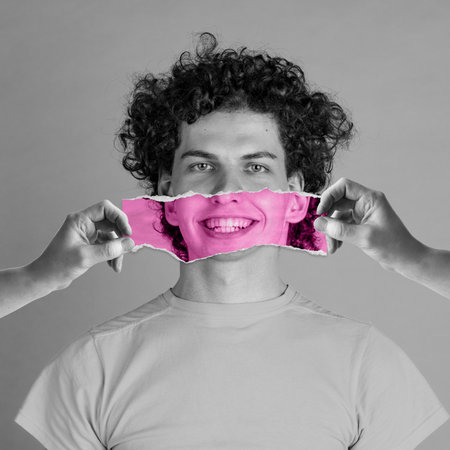 Positive lifestyle. Human hand holding photo part with smile near mans calm face. Conceptual art collage. Delightful. Concept of human emotions, diversity, inner world, psychologyの写真素材