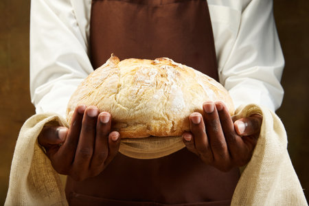 Traditional festive round loaf of bread for wedding on towel. Concept of food, health, traditions,...