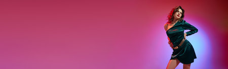 Banner. Portrait of posing woman, fashion model wearing cokctail dress with accessories over violet-pink neon background. Concept of beauty, fashion week, human emotions, trends, adの写真素材