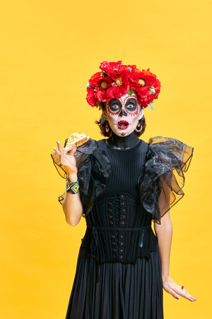 Happy halloween. Katrina. Young surprised woman n in spooky makeup eating delicious hot pizza...