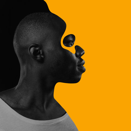 Poster. Contemporary art collage. Black-white profile portrait of young confident African-American man highlighted orange paint boldly looks to future. Concept of Black History Month, civil rights.の写真素材