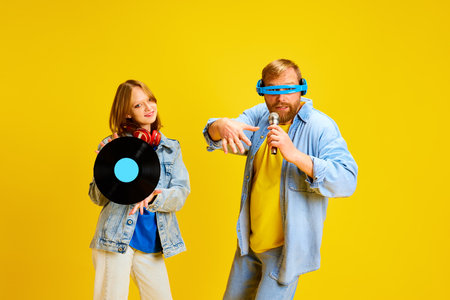 Family day. Funny father and daughter, parent and kid dressed style denim outfit and have fun with...