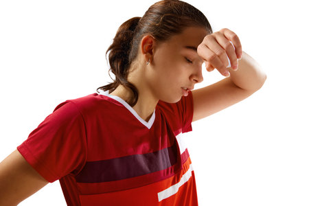 Close up portrait of young girl, professional badminton player have rest between times and put hand on head against white studio background. Concept of sport, active lifestyle, action. Copy space.の写真素材