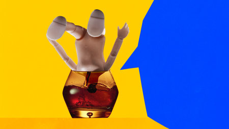 Contemporary art collage. Body Cocktail. Glass of whiskey and headless doll drowning in it against yellow background with blue speech bubble. Concept of party, surreal, nightclub, Friday moodの写真素材