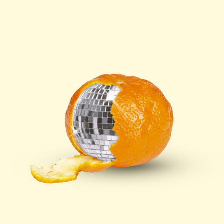 Contemporary art collage. Juicy mandarin with disco ball inside. Natural fruit with elements of celebration. Concept of pop art, lifestyle, surprises, emotions, feelings. Adの写真素材