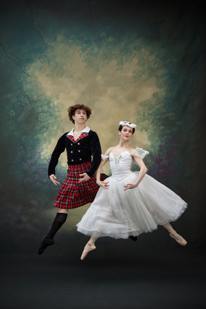 Ballerina performs high leap, perfectly matched by her partner. Scene of famous performance against vintage background. Concept of art, fusion of classic and modernity, grace and elegance.の写真素材