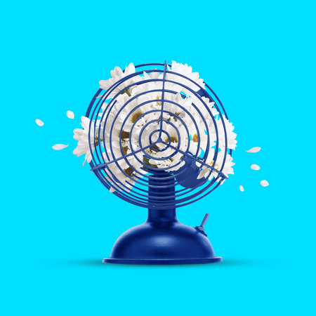 Contemporary art collage. Blue folding fan full with flowers against vivid blue background. The...