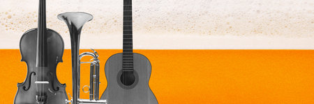 Banner. Contemporary art collage. Violin, trumpet, and guitar against backdrop of frothy beer and vibrant orange, capturing harmony of music and refreshment. Concept of music, traditions, Oktoberfest.の写真素材