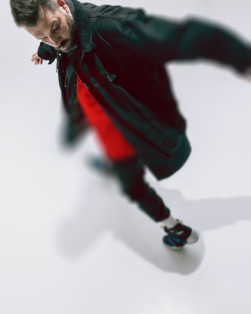 Dynamic, aerial view photo of dancing man with glass morphism effect. Focus on face and upper body,...