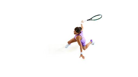 Tennis player prepares to hit, displaying readiness and focus, perfectly show calm intensity before powerful serve against white background. Concept of professional sport, championship, tournament.の写真素材