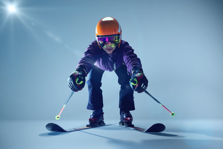 Love English view of athlete ready to leaps, poles extended backward, against softly illuminated blue backdrop. Concept of extreme sport, Christmas holidays. Adの写真素材