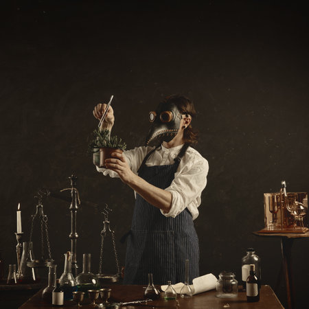 Carefully measuring spice or herb into large jar, plague doctor appears to be creating tincture or infusion, surrounded by classic laboratory tools. Concept of medicine, science, pharmaceutical.の写真素材