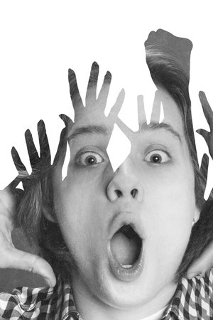 Contemporary art collage. Young man with wide-open eyes and mouth, expressing shock, layered with...