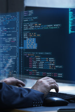 Hands working on keyboard with fictional code display, representing virtual interplay of human...