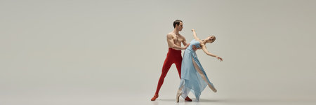 Male ballet dancer supporting female partner in deep backbend, arms sculpting dynamic line, poised...