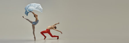Banner. Dancers freeze in air shows classic ballet poses and controlled motion creating seamless visual flow against white background. Concept of ballet, elegance, dynamics, art, poetry in motion.の写真素材