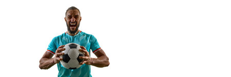 Banner. portrait of young football player, holding football looking at camera and shouting against...