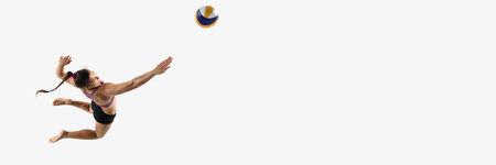 Banner. Aerial view of athletic woman airborne preparing volleyball attack against white studio background with negative space. Concept of power, skill, coordination, sport performance, championshipの写真素材