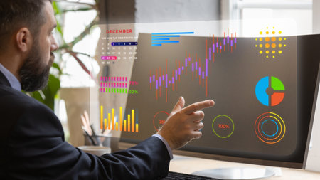 Professional in suit points to colorful digital statistics and charts, including calendar and pie...