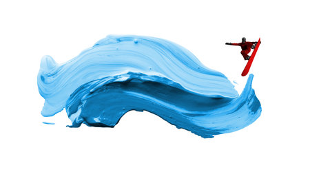 Creative artwork. Snowboarder jumps high above abstract wave of blue paint in creative surreal action. Concept of extreme sport, adrenaline, modern art, freedom, and dynamic winter lifestyle.の写真素材