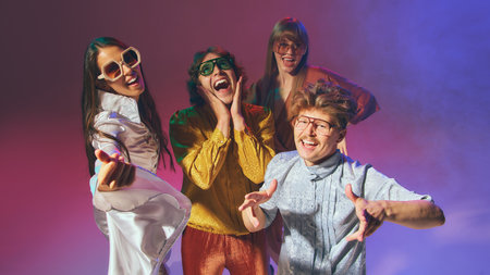 Retro friends group posing joyfully in colorful disco style. Concept of pop culture revival, vintage...