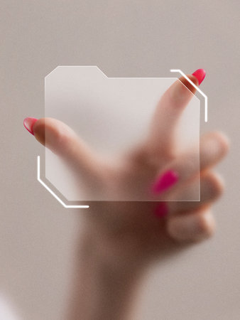 Graphic composition. Hand with pink nails holding transparent digital folder icon in futuristic interface. Concept of data storage, organization, digital innovation, and emotional control.の写真素材