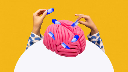 Graphic composition. Hands inserting capsules into pink brain symbolizing neuropharmacology. Concept...
