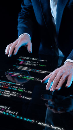 Hands on transparent digital surface with luminous programming code in futuristic composition. Concept of research technology, interactive design, and innovation in scientific visualization.の写真素材