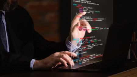 Trendy collage. Professional programmer working with transparent digital display in dark environment. Concept of cyber security, data analysis, software engineering, and modern digital systems.の写真素材