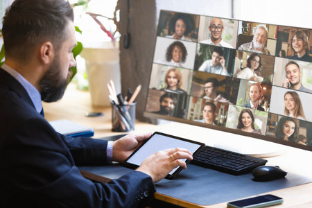 Creative collage. Businessman in video conference with multinational team. Concept of remote collaboration, leadership communication, corporate training, and digital workplace connection.の写真素材