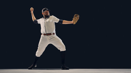 Baseball pitcher extending arm in full throw position showing body rotation. Concept of motion...