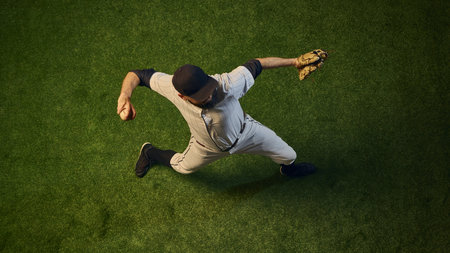 Baseball pitcher top view throwing motion with rotational power and arm extension. Concept of body mechanics, professional training, sports science visualization for analysis and coaching.の写真素材