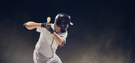 Baseball batter close-up ready to hit ball showing grip and upper body control. Concept of hitting preparation, mental focus, strength display for educational visuals.の写真素材