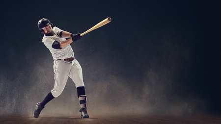 Baseball batter finishing full swing showing powerful rotation and balance on dusty field. Concept...