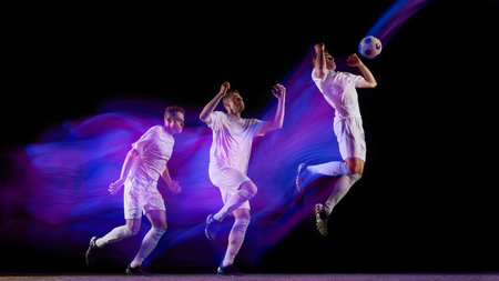 Sequence of soccer player jumping for header with glowing neon light motion. Concept of coordination, power, focus used in motion capture, athlete education, and sports analysis visuals.の写真素材