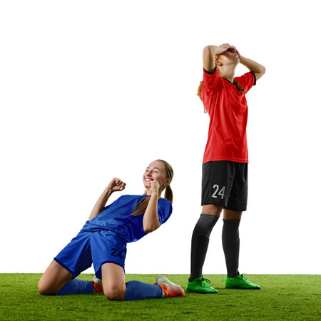 Female football players celebrating victory and reacting to defeat with strong emotion. Concept of storytelling, match reports, mental training, team motivation.の写真素材