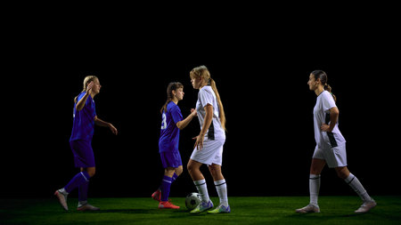 Young soccer players coordinating midfield play during possession. Concept of tactical instruction, controlled buildup teaching, coaching diagrams, structured sports lessons.の写真素材