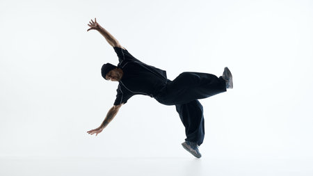 Professional breakdancer performing inverted power move isolated. Concept of high level street dance...