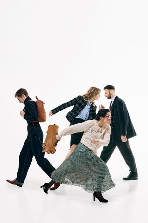 Business team crossing paths in expressive walking poses on white background. Concept of corporate...