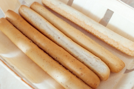 Crunchy crackers sticks in a wicker boxの写真素材