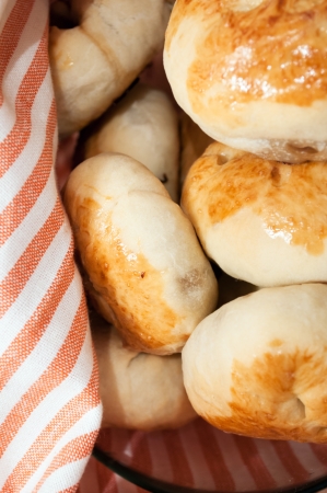 Big plate of russian pirogi covered with a towelの写真素材