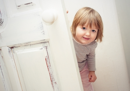 Little girl having fun playing at homeの写真素材