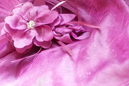 Artifical fabric flower and beads on pink backgroundの写真素材