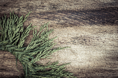 Wreath of herbal ears on vintage wooden background. Summertimeの写真素材